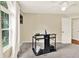 A sunny bedroom with neutral carpet and walls with a large window that provides natural light at 230 Channings Lake Dr, Lawrenceville, GA 30043