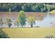 Scenic lake view with lush trees and green lawns creating a tranquil natural setting at 230 Channings Lake Dr, Lawrenceville, GA 30043