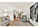 A bright and open living room with hardwood floors and neutral decor at 230 Channings Lake Dr, Lawrenceville, GA 30043