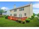Back of house with wooden deck, large backyard, lots of windows, and vinyl siding at 606 Hay Meadow, Acworth, GA 30102