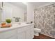 Bathroom with vanity, mirror and a floral patterned shower curtain at 606 Hay Meadow, Acworth, GA 30102