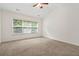 Bedroom featuring natural light from large window, plush carpeting and neutral walls at 606 Hay Meadow, Acworth, GA 30102