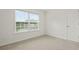 This bedroom features plush carpet, a bright window with views, and ample space at 606 Hay Meadow, Acworth, GA 30102