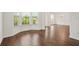 Bright dining area featuring hardwood floors, three windows, and a chandelier at 606 Hay Meadow, Acworth, GA 30102