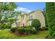 Charming two-story home featuring a red door, manicured lawn and a two car garage at 606 Hay Meadow, Acworth, GA 30102