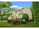 Charming two-story home featuring a red door, manicured lawn and a two car garage at 606 Hay Meadow, Acworth, GA 30102