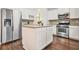 Kitchen with island, stainless steel appliances, white cabinetry and lots of countertop space at 606 Hay Meadow, Acworth, GA 30102