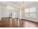 Bright living room with hardwood floors, white trim, and many windows at 606 Hay Meadow, Acworth, GA 30102