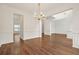 Bright living room with hardwood floors, white trim, and a chandelier at 606 Hay Meadow, Acworth, GA 30102