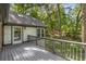 Inviting back deck area offers scenic views of the lush backyard, perfect for relaxing or entertaining guests at 965 Heards Ferry Rd, Sandy Springs, GA 30328