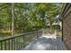 Spacious back deck offers a tranquil space for outdoor living and enjoying the surrounding nature at 965 Heards Ferry Rd, Sandy Springs, GA 30328