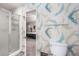 This bathroom offers a glass shower and calming wallpaper at 965 Heards Ferry Rd, Sandy Springs, GA 30328