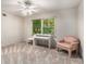 Bright bedroom with a desk area by the window, allowing for a comfortable workspace with natural light at 965 Heards Ferry Rd, Sandy Springs, GA 30328