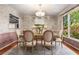 Elegant dining room featuring hardwood floors, chandelier, and decorative wallpaper at 965 Heards Ferry Rd, Sandy Springs, GA 30328