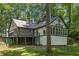 View of the rear exterior elevation showing a deck and sunroom at 965 Heards Ferry Rd, Sandy Springs, GA 30328