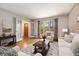 Comfortable living room featuring hardwood floors, stylish furnishings, and leaded glass windows at 965 Heards Ferry Rd, Sandy Springs, GA 30328