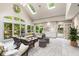 Bright and airy sunroom with vaulted ceilings, skylights, and a wall of windows overlooking the landscaped yard at 965 Heards Ferry Rd, Sandy Springs, GA 30328