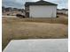 Exterior view of the backyard with a patio and grass at 1001 Limburg Dr, Hampton, GA 30228
