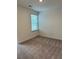 A carpeted bedroom with a window, providing ample natural light at 1001 Limburg Dr, Hampton, GA 30228