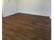 Open living room boasts brand new wood floors, and a neutral color palette at 1001 Limburg Dr, Hampton, GA 30228