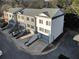 Aerial view of three story townhomes with individual stairs and garages at 208 Wade Creek Rd, Alpharetta, GA 30009
