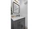 Modern bathroom with a gray vanity, contemporary mirror, and stylish fixtures at 208 Wade Creek Rd, Alpharetta, GA 30009