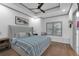 Bright bedroom with a ceiling fan, plantation shutters, and hardwood floors at 208 Wade Creek Rd, Alpharetta, GA 30009