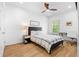 Inviting bedroom with hardwood floors, a ceiling fan, and a comfortable queen-sized bed at 208 Wade Creek Rd, Alpharetta, GA 30009