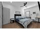 Second bedroom with a window, desk, and ceiling fan at 208 Wade Creek Rd, Alpharetta, GA 30009