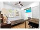 Cozy bedroom with hardwood floors, a ceiling fan, and a comfortable bed at 208 Wade Creek Rd, Alpharetta, GA 30009