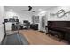 Bonus room with a treadmill, piano, desk, and chair at 208 Wade Creek Rd, Alpharetta, GA 30009