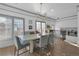 Bright dining area with gray walls, stylish plantation shutters, and modern light fixtures at 208 Wade Creek Rd, Alpharetta, GA 30009