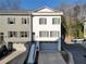 Charming townhome showcasing a private garage, gray accents, an entryway, and meticulous landscaping at 208 Wade Creek Rd, Alpharetta, GA 30009