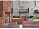 Exterior backyard patio area featuring a brick fireplace at 208 Wade Creek Rd, Alpharetta, GA 30009