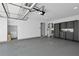 Large garage with white walls, gray floor, cabinets and storage at 208 Wade Creek Rd, Alpharetta, GA 30009