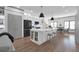 Modern kitchen featuring a large island, stainless steel appliances, and white cabinetry at 208 Wade Creek Rd, Alpharetta, GA 30009