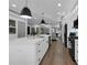 Bright kitchen island with a sink, stainless steel appliances, and hardwood floors at 208 Wade Creek Rd, Alpharetta, GA 30009