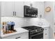 Close up of kitchen featuring stainless steel appliances, white countertops, and plenty of cabinet space at 208 Wade Creek Rd, Alpharetta, GA 30009