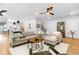 Open-concept living room and kitchen area with hardwood floors and plenty of natural light at 208 Wade Creek Rd, Alpharetta, GA 30009