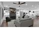 Bright living space features a fireplace and built ins, and is open to a modern kitchen at 208 Wade Creek Rd, Alpharetta, GA 30009