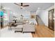 Bright living room with open floor plan connecting to kitchen and stairs to the next level at 208 Wade Creek Rd, Alpharetta, GA 30009