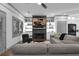 Inviting living room with a fireplace, built-in shelving, and comfortable seating arrangement at 208 Wade Creek Rd, Alpharetta, GA 30009