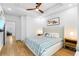 Serene main bedroom with hardwood floors, tray ceiling, and ample natural light at 208 Wade Creek Rd, Alpharetta, GA 30009