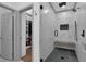 A modern shower room with marble walls, glass enclosure, and a built-in bench at 208 Wade Creek Rd, Alpharetta, GA 30009