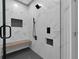 A luxurious shower featuring a built-in bench and stylish tile work at 208 Wade Creek Rd, Alpharetta, GA 30009