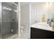 Bathroom featuring tiled shower, large vanity with dual sinks and a modern mirror at 2517 Hedgeway Cir, Kennesaw, GA 30144