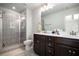 Modern bathroom with tiled shower, dual sink vanity, and contemporary fixtures at 2517 Hedgeway Cir, Kennesaw, GA 30144