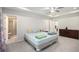 Bright bedroom with tray ceilings and access to an ensuite bathroom at 2517 Hedgeway Cir, Kennesaw, GA 30144
