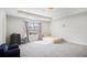Bright bedroom with large window, neutral carpet, and tray ceiling at 2517 Hedgeway Cir, Kennesaw, GA 30144