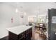 Open-concept kitchen featuring a center island, stainless steel appliances, and hardwood floors at 2517 Hedgeway Cir, Kennesaw, GA 30144